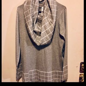 Two piece lady sweater and scarf set.